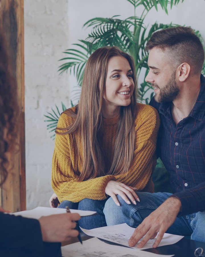A couple talking with their loan officer